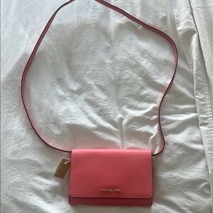 Michael Kors Pink Crossbody Bag with Flap Closure